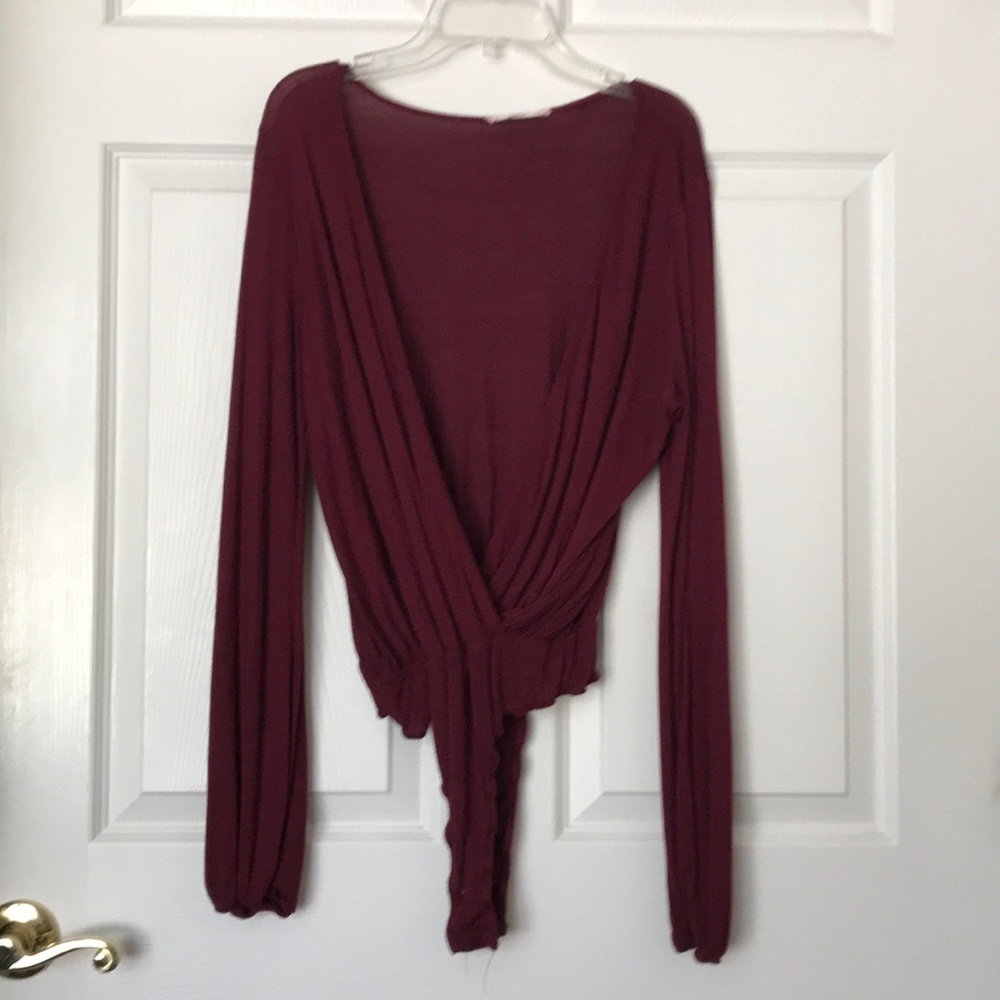 Open front maroon body suit.